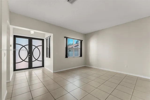 a view of an empty room and window