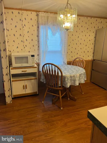 a kitchen with stainless steel appliances a stove a sink and a refrigerator