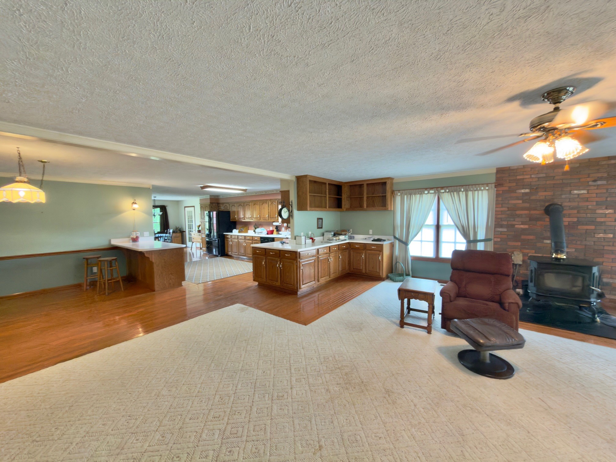 4929 Fountain Grove Road Morrison, TN 37357 - Photo 16 of 33 a living room with furniture and a dining table with kitchen view