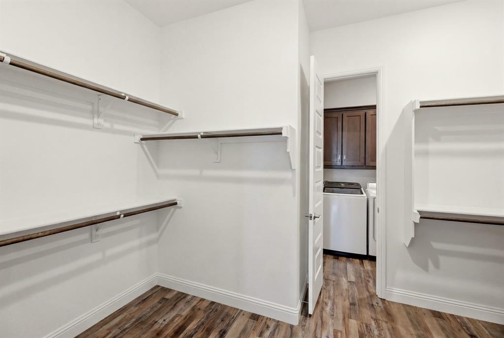 1313 Kirkwood Road Rockwall, TX 75087 - Photo 25 of 39 Primary closet leads to laundry room - the best design!