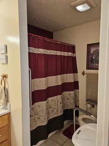 a bathroom with a bathtub and shower