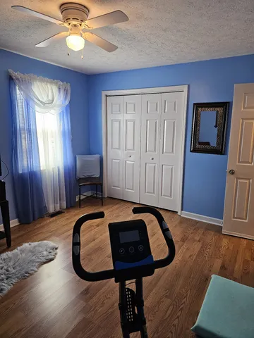 a view of a livingroom with furniture and wooden floor