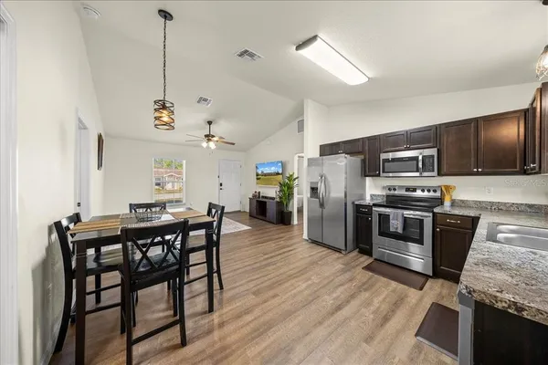 a bedroom with a bed and a table