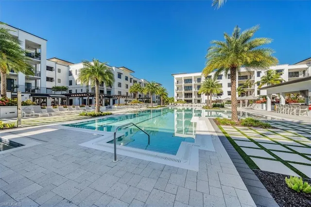 a view of a swimming pool with a lounge chairs