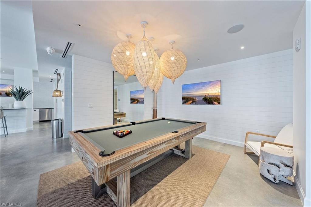 1115 Central Avenue, Unit 445 Naples, FL 34102 - Photo 17 of 20 a room with pool table and windows