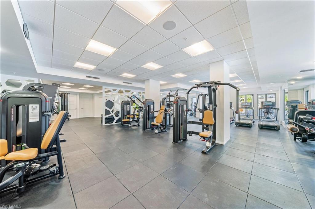 1115 Central Avenue, Unit 445 Naples, FL 34102 - Photo 18 of 20 a view of a room with gym equipment