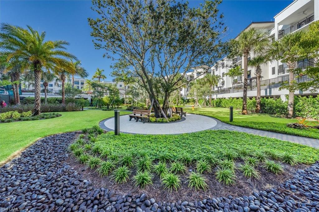 1115 Central Avenue, Unit 445 Naples, FL 34102 - Photo 20 of 20 a view of a park with a bench