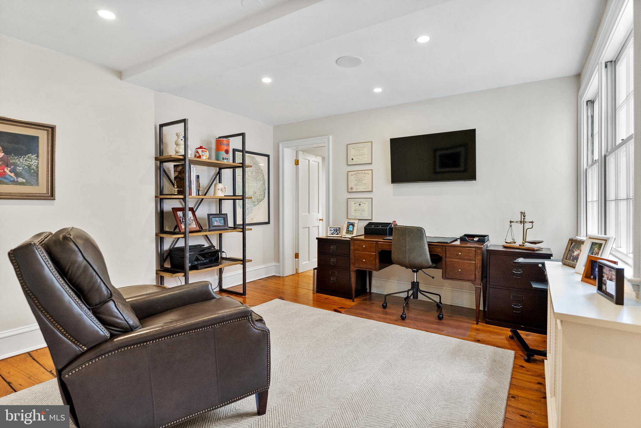 3403 O Street Northwest Washington, DC 20007 - Photo 21 of 35 a living room with furniture a flat screen tv and a window