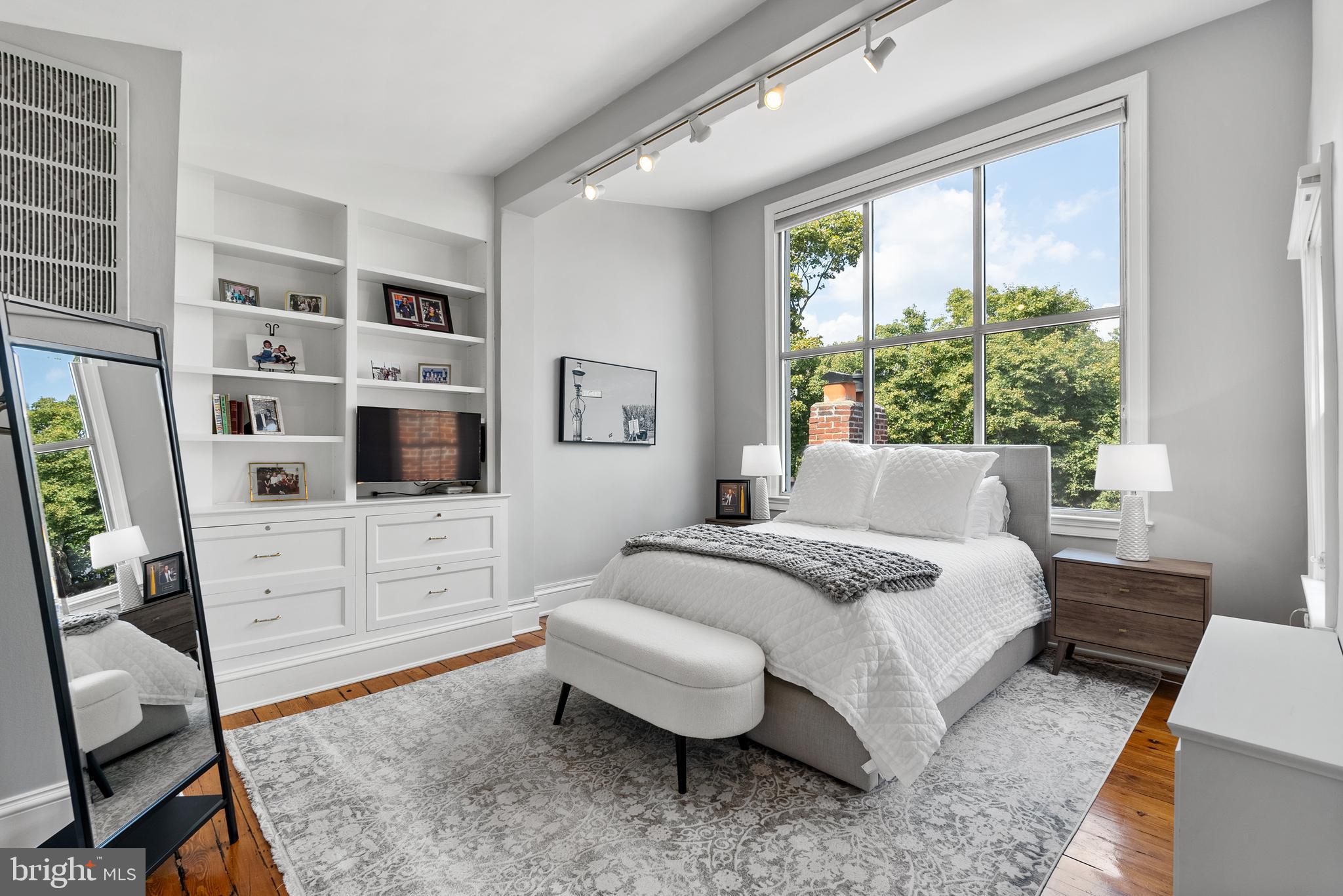 3403 O Street Northwest Washington, DC 20007 - Photo 24 of 35 a bedroom with a bed a flat screen tv and dresser