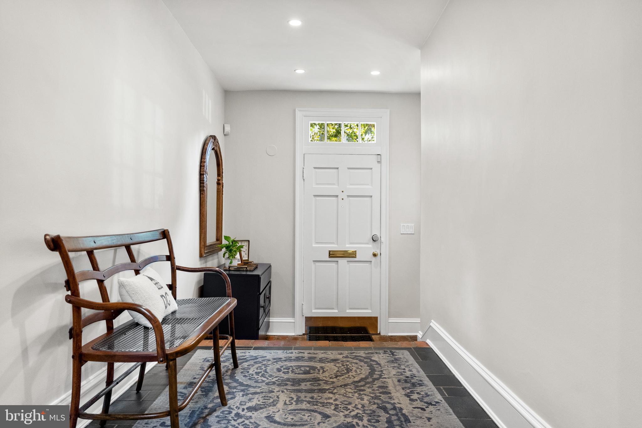 3403 O Street Northwest Washington, DC 20007 - Photo 4 of 35 a view of a hallway with wooden floor and a potted plant
