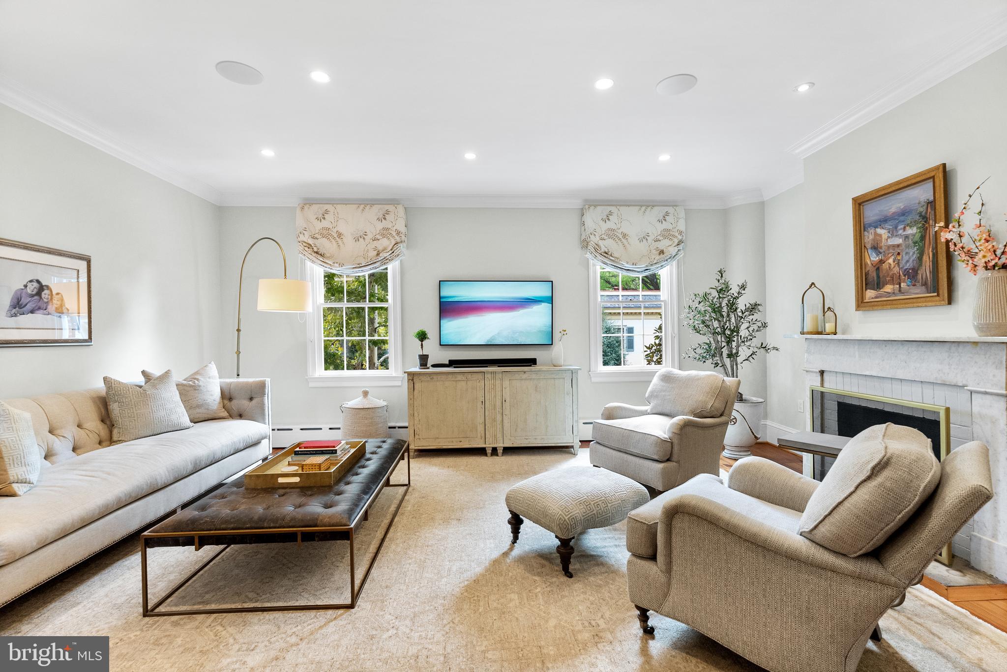 3403 O Street Northwest Washington, DC 20007 - Photo 7 of 35 a living room with furniture a large window and a flat screen tv