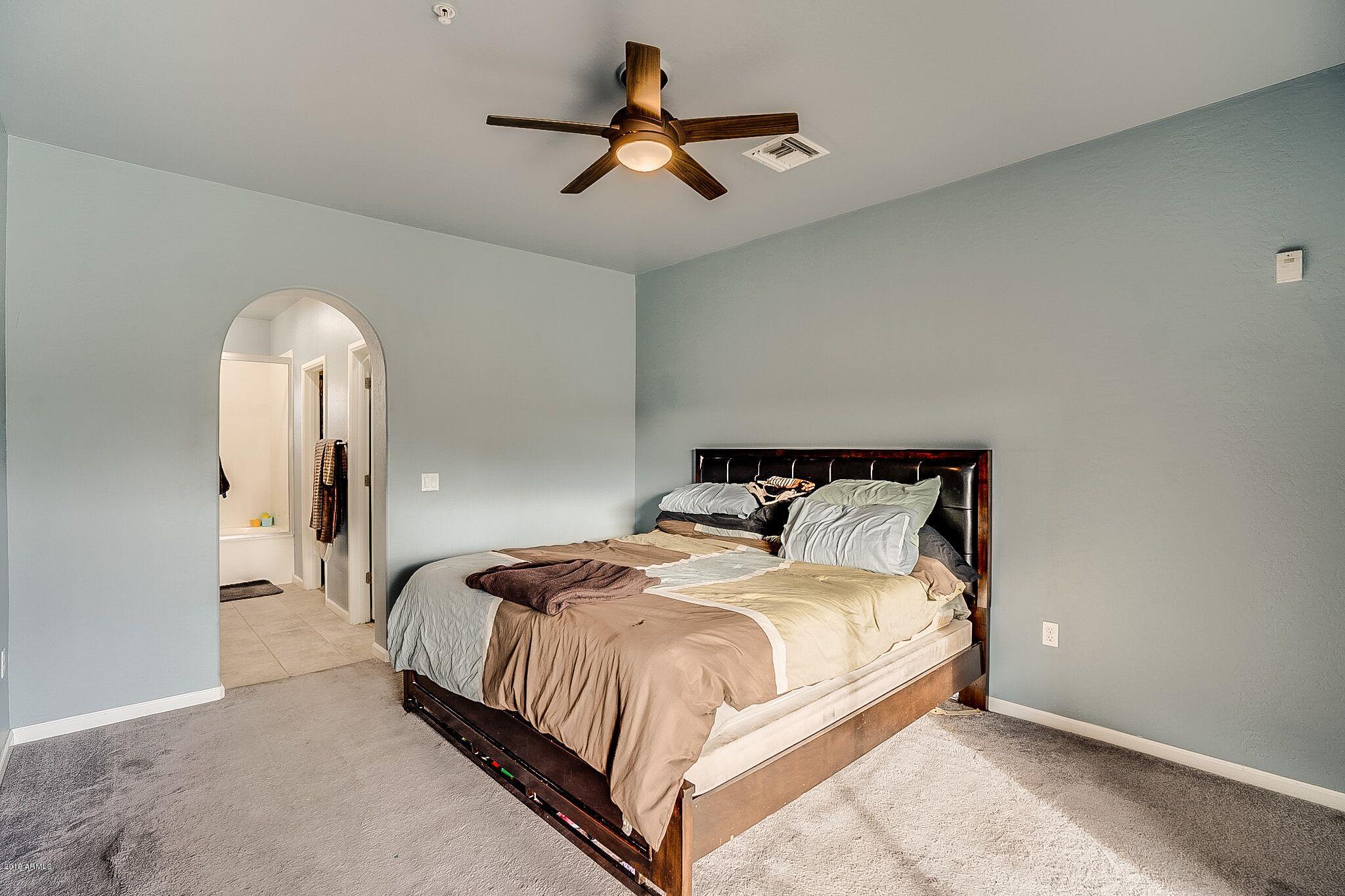 3935 East Rough Rider Road, Unit 1075 Phoenix, AZ 85050 - Photo 9 of 31 RR master bedroom