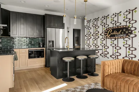 a living room with a couch and a curtain