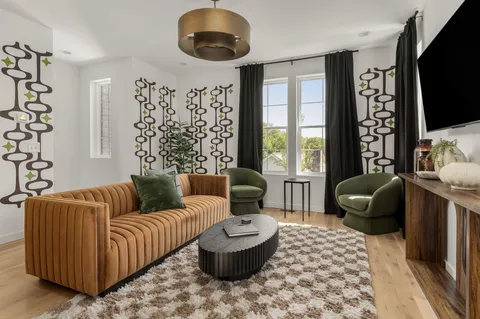 a view of a roof deck with table and chairs