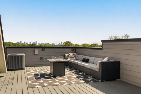 a view of balcony with furniture