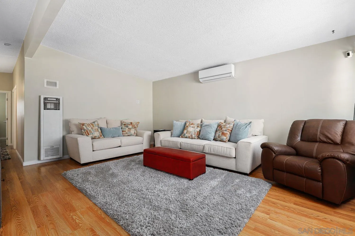 8619 Harness Street Spring Valley, CA 91977 - Photo 3 of 23 a living room with furniture and a wooden floor