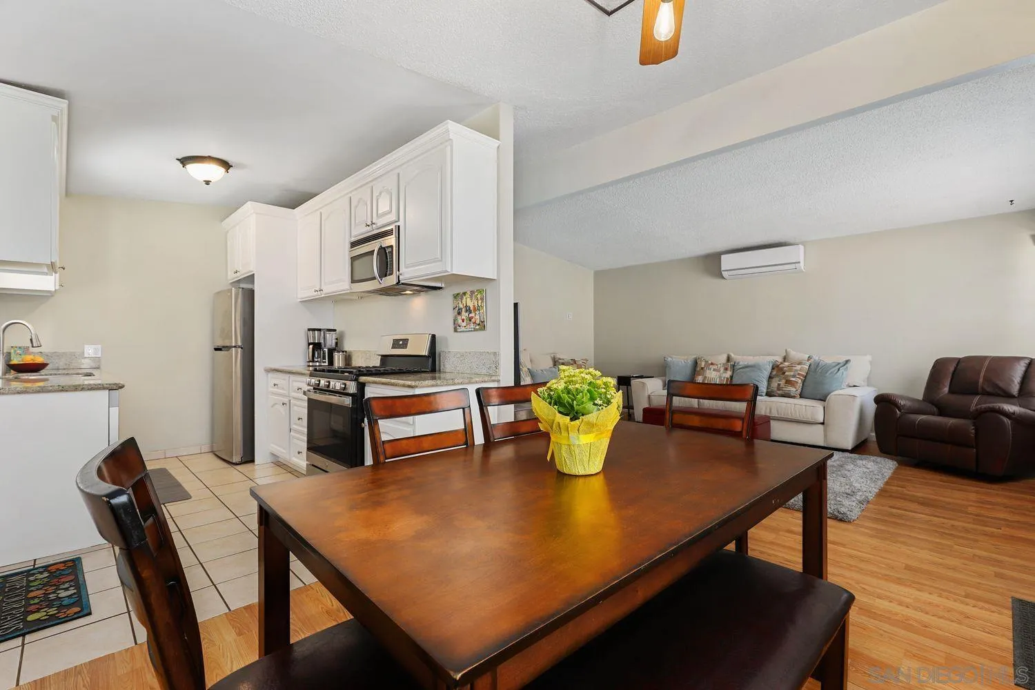 8619 Harness Street Spring Valley, CA 91977 - Photo 5 of 23 a kitchen with a dining table and chairs