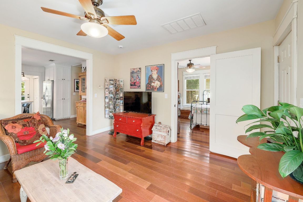 1006 East 44th Street Austin, TX 78751 - Photo 3 of 28 Welcoming living area with natural light and stunning hardwood floors. Please note entire interior of 1006 E. 44th Street was painted 11/25 after interior photos were taken.