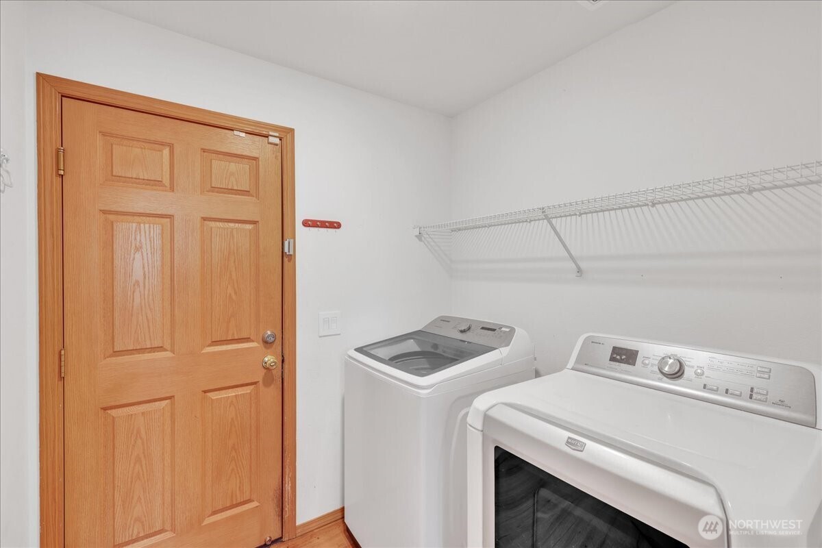 322 Orting Avenue Northwest Orting, WA 98360 - Photo 16 of 36 a utility room with dryer and washer