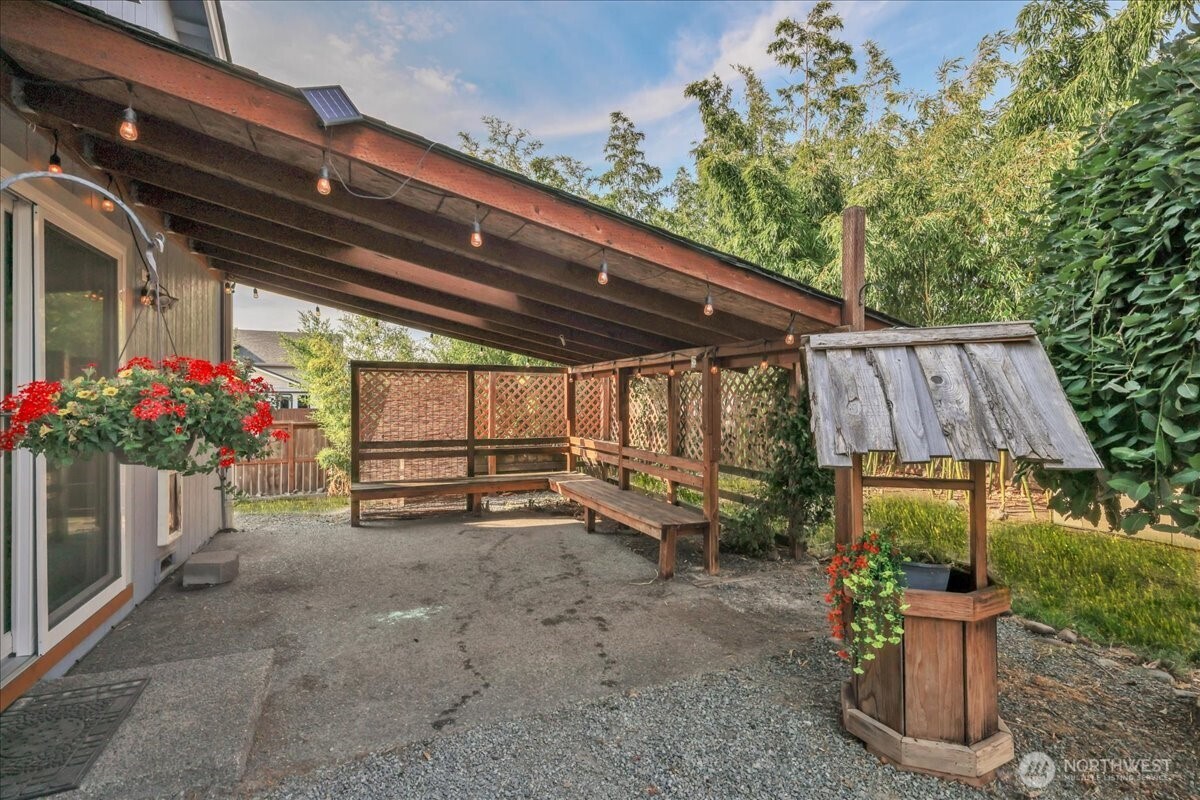 322 Orting Avenue Northwest Orting, WA 98360 - Photo 28 of 36 a view of a backyard with plants and a patio