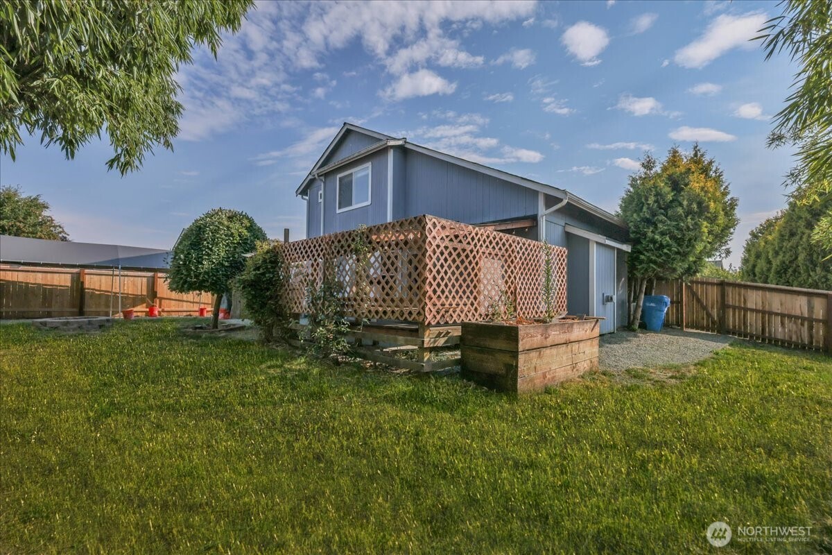 322 Orting Avenue Northwest Orting, WA 98360 - Photo 30 of 36 a front view of a house with a yard