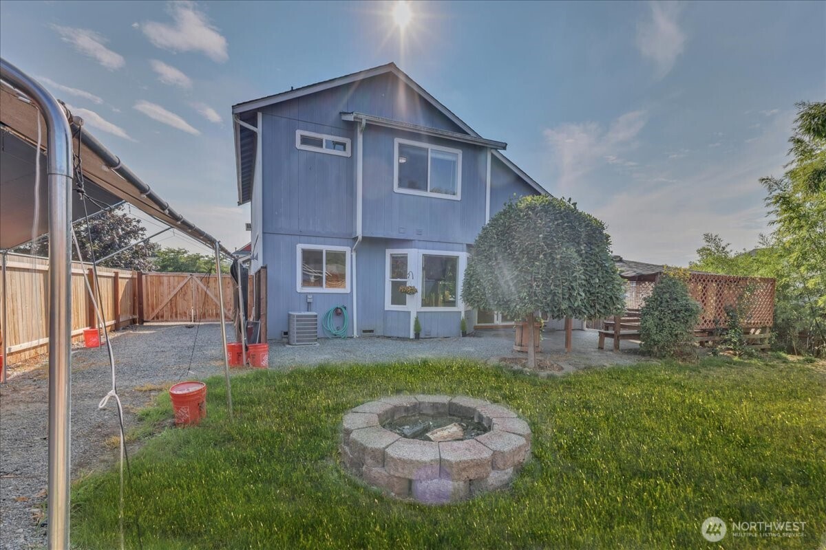 322 Orting Avenue Northwest Orting, WA 98360 - Photo 31 of 36 a view of a house with a yard and pathway