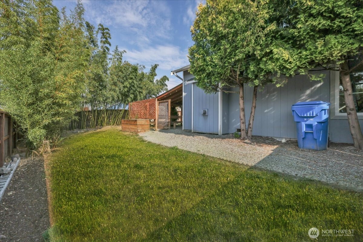322 Orting Avenue Northwest Orting, WA 98360 - Photo 32 of 36 a front view of a house with a yard and tree