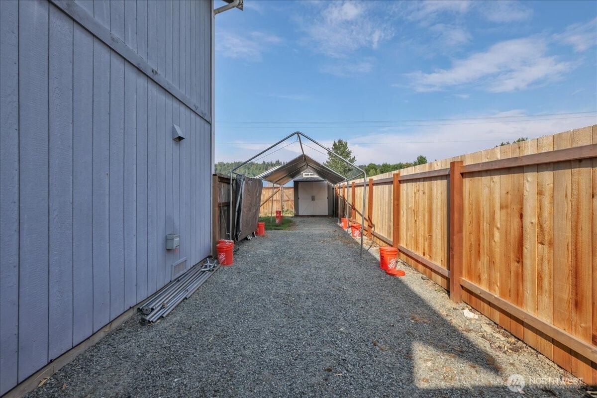 322 Orting Avenue Northwest Orting, WA 98360 - Photo 33 of 36 a view of an entryway with wooden fence