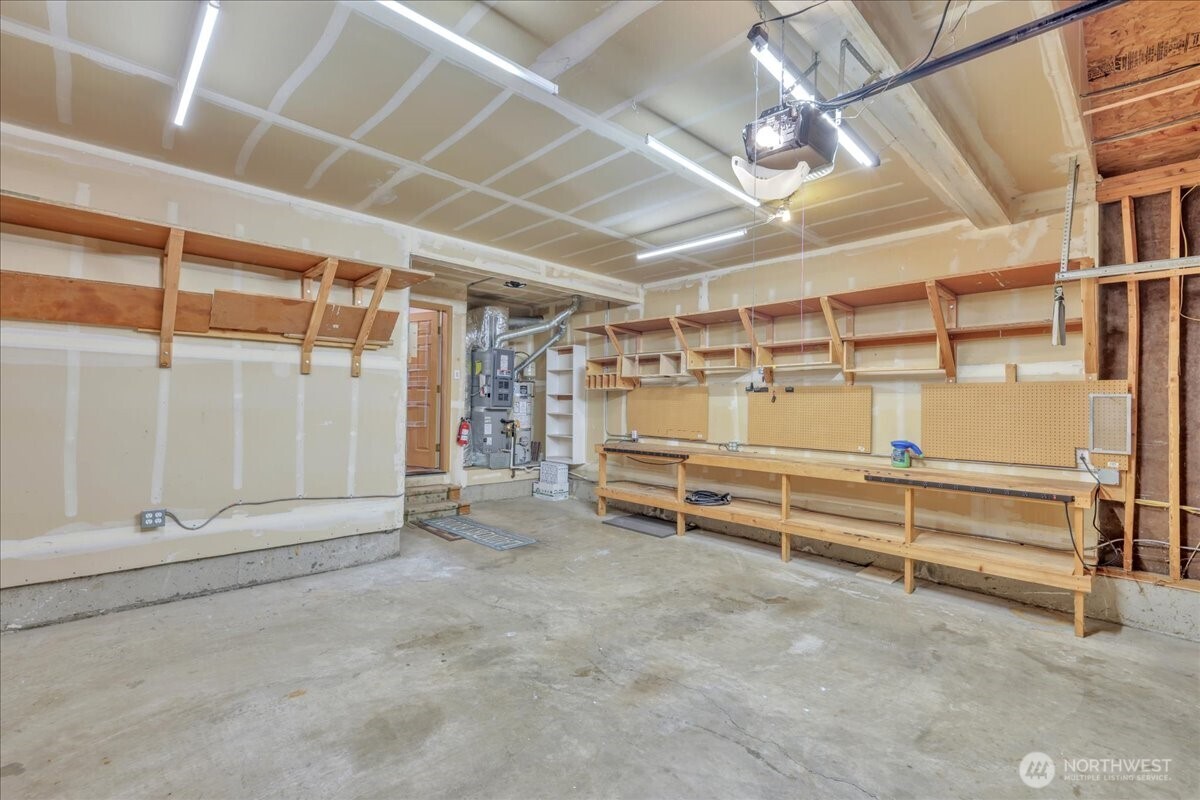 322 Orting Avenue Northwest Orting, WA 98360 - Photo 34 of 36 a view of an empty room with racks on the wall