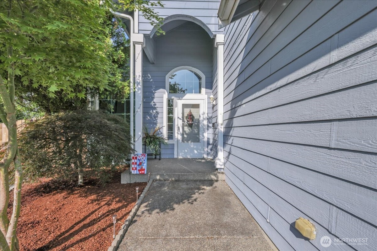 322 Orting Avenue Northwest Orting, WA 98360 - Photo 4 of 36 a front view of a house with garden