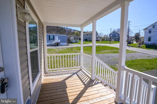 a view of a deck with a yard