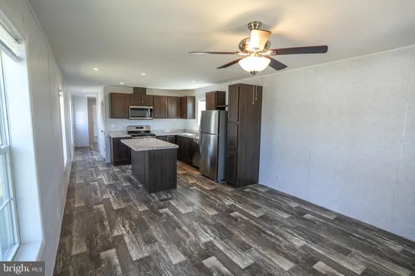 a kitchen with stainless steel appliances a refrigerator and a sink