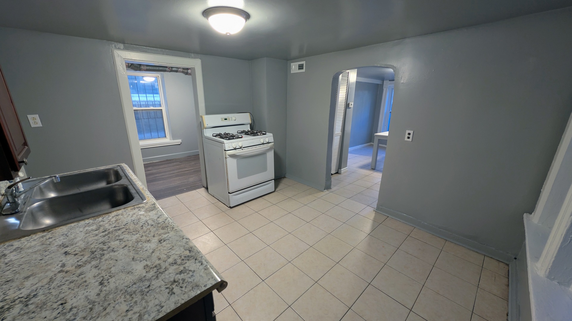 1629 West Beach Avenue, Unit 1F Chicago, IL 60622 - Photo 2 of 7 a bathroom with a sink toilet and mirror