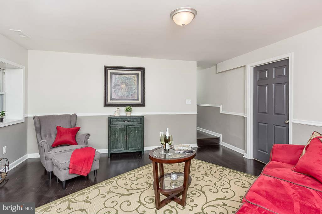 1134 Maple Road Baltimore, MD 21221 - Photo 3 of 29 Living Room with Custom Paint & Chair Railing!