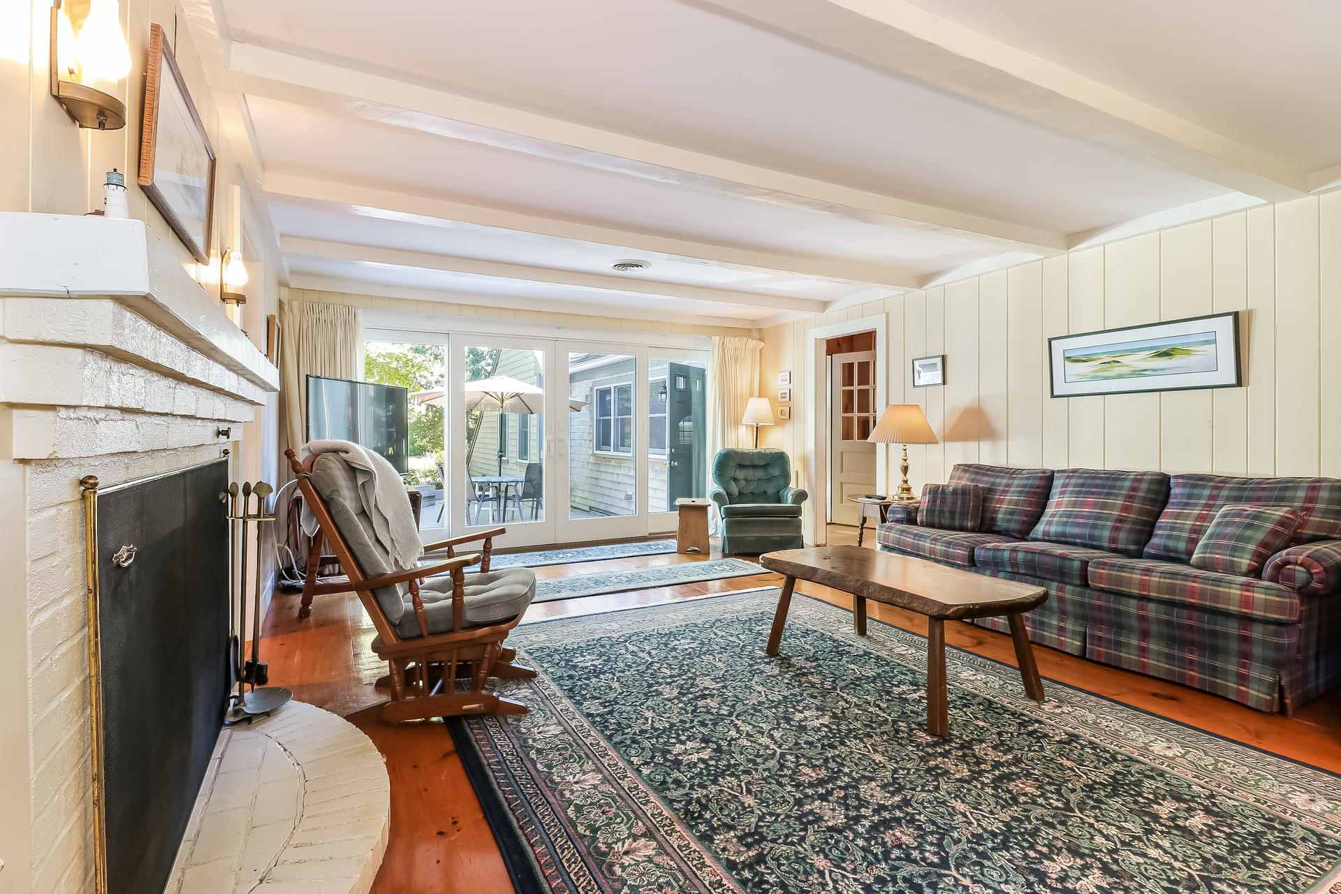 45 Brooks Road Harwich Port, MA 02646 - Photo 11 of 34 a living room with furniture and a fireplace