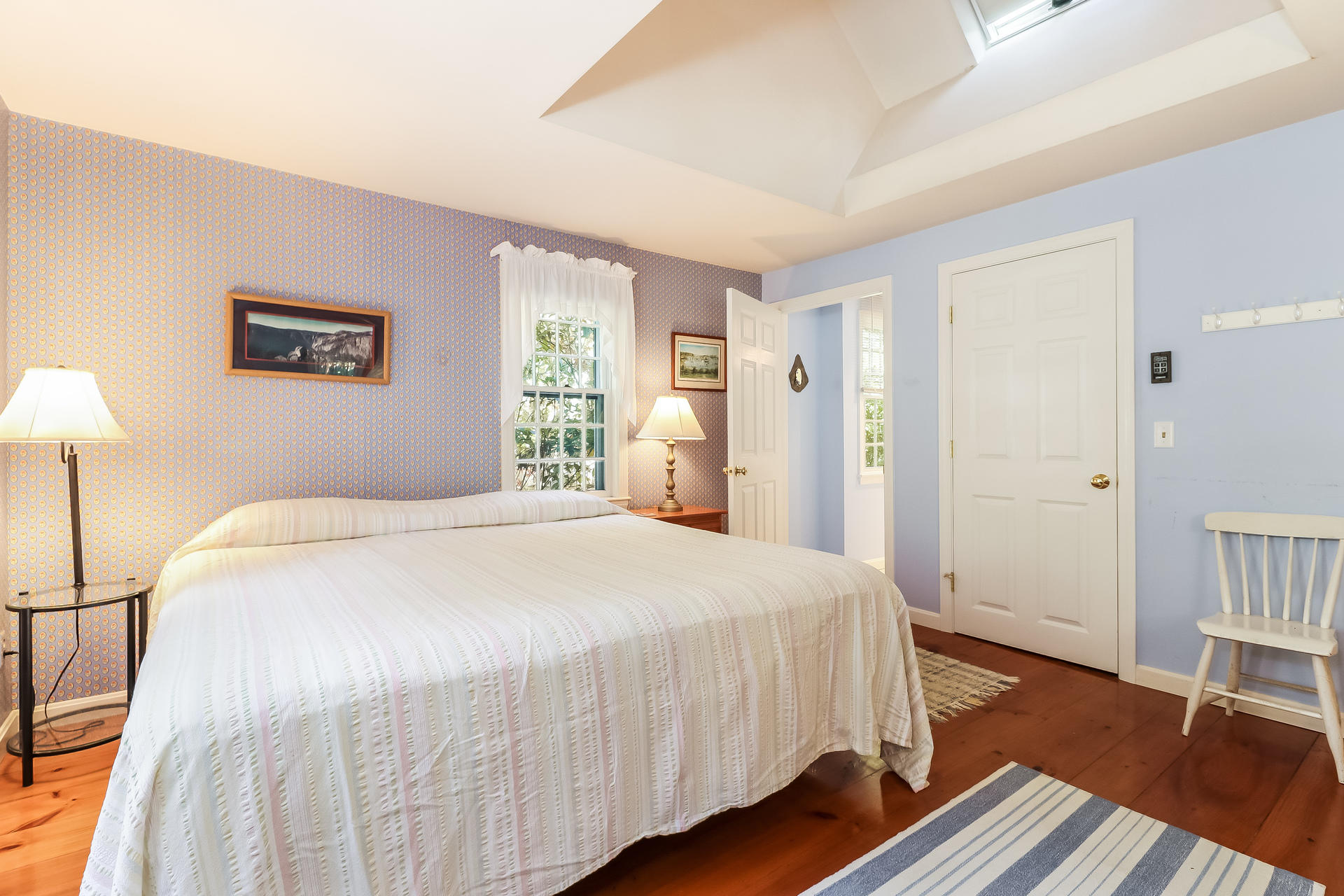 45 Brooks Road Harwich Port, MA 02646 - Photo 12 of 34 a bedroom with a bed and a table in it
