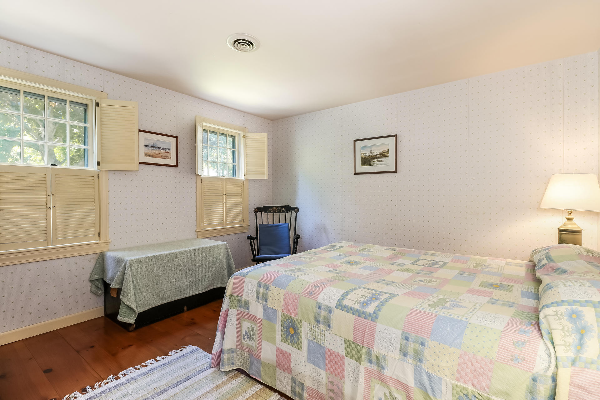 45 Brooks Road Harwich Port, MA 02646 - Photo 15 of 34 a bedroom with a bed and a lamp on table