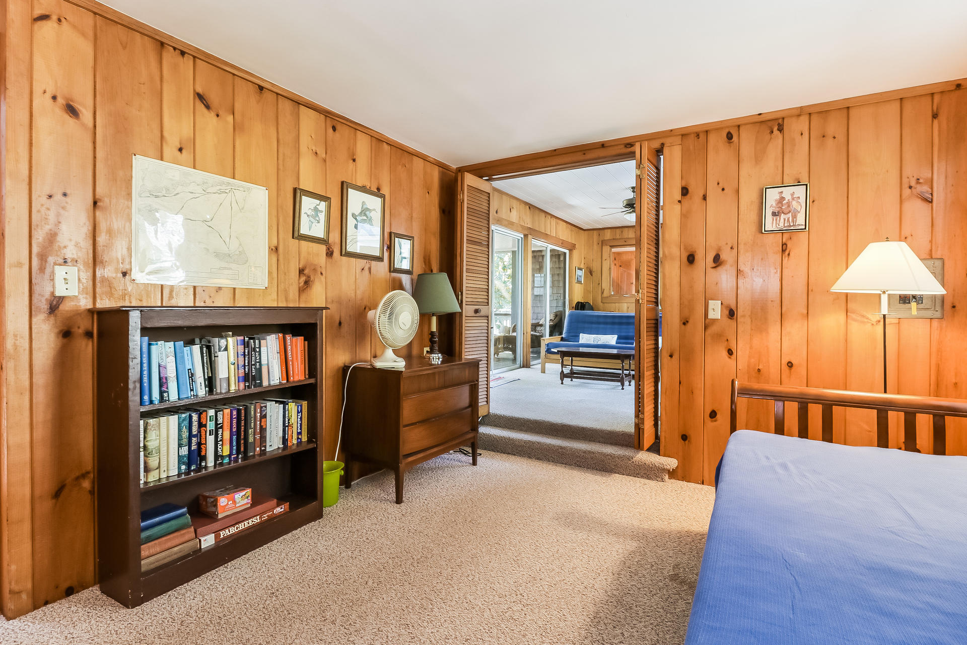 45 Brooks Road Harwich Port, MA 02646 - Photo 21 of 34 a bedroom with furniture and a book shelf