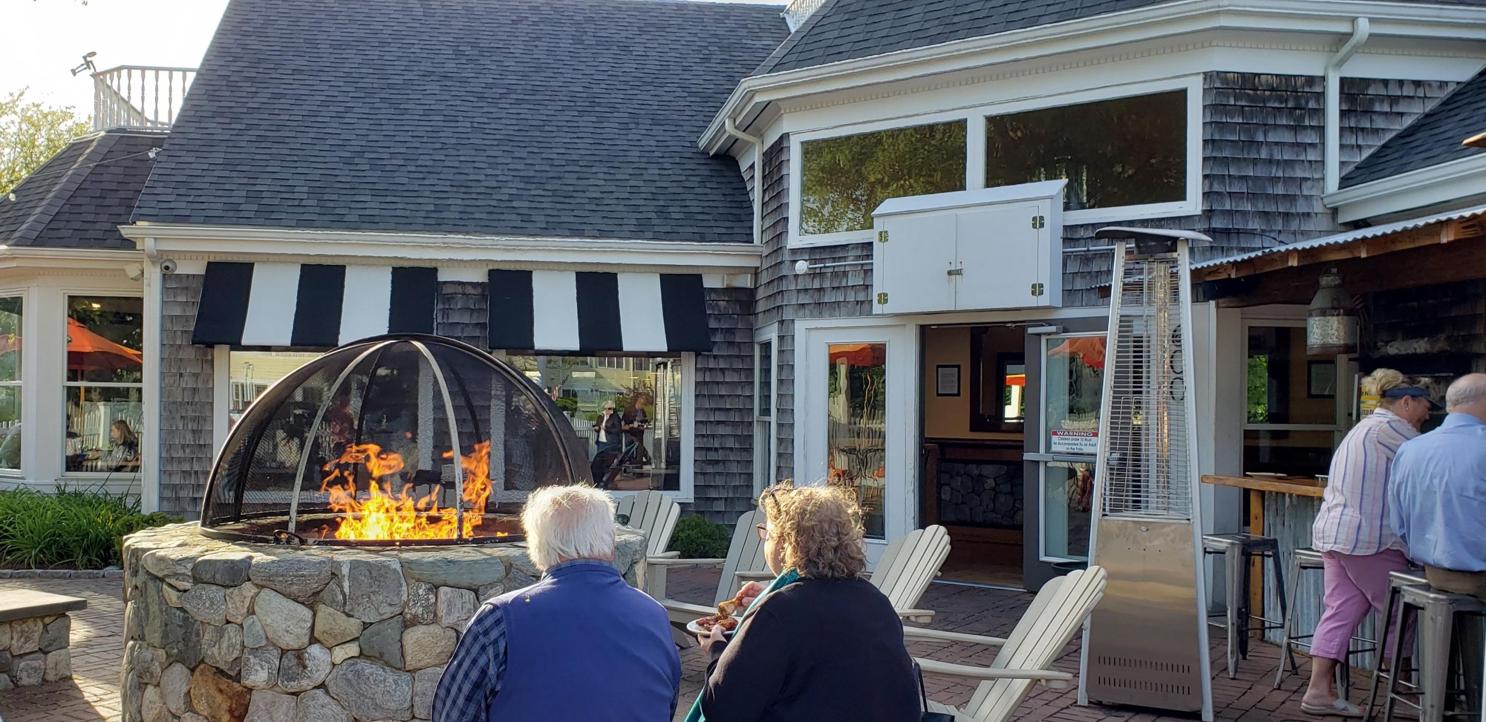 45 Brooks Road Harwich Port, MA 02646 - Photo 33 of 34 a front view of a house with outdoor seating and flat screen tv