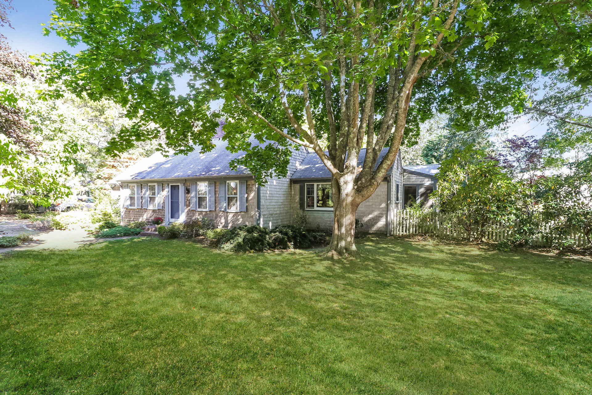 45 Brooks Road Harwich Port, MA 02646 - Photo 6 of 34 a front view of a house with a garden
