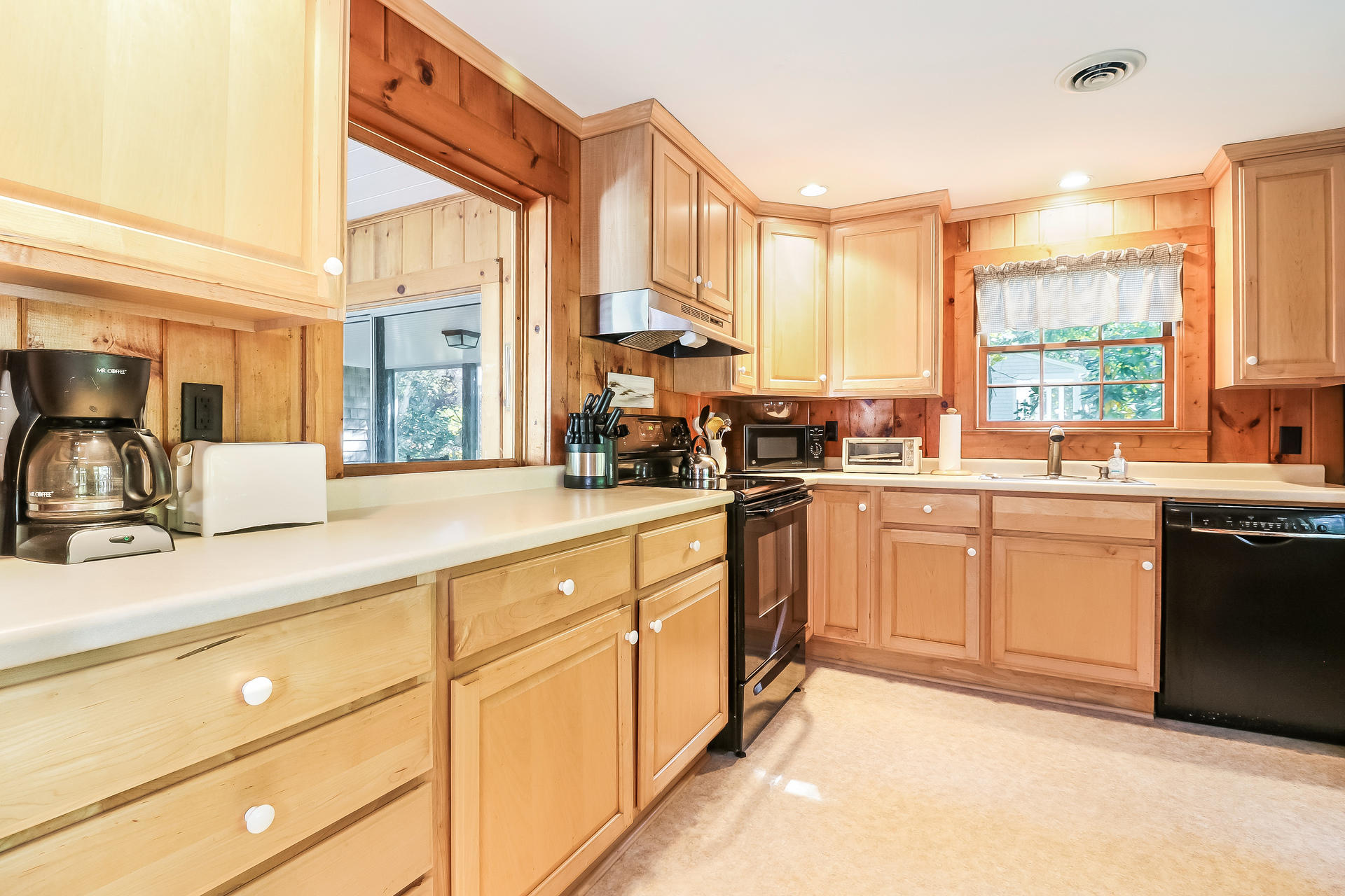 45 Brooks Road Harwich Port, MA 02646 - Photo 7 of 34 a kitchen with stainless steel appliances granite countertop a sink a stove and cabinets