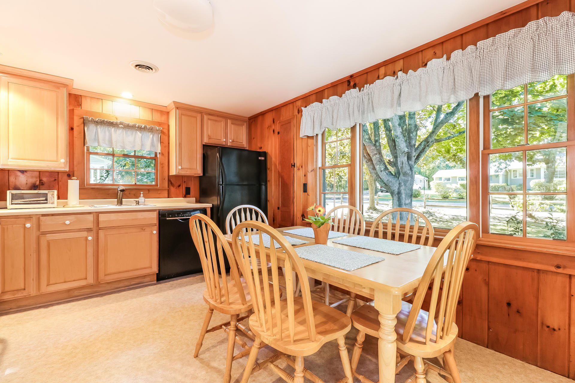 45 Brooks Road Harwich Port, MA 02646 - Photo 9 of 34 a dining room with furniture a chandelier and wooden floor