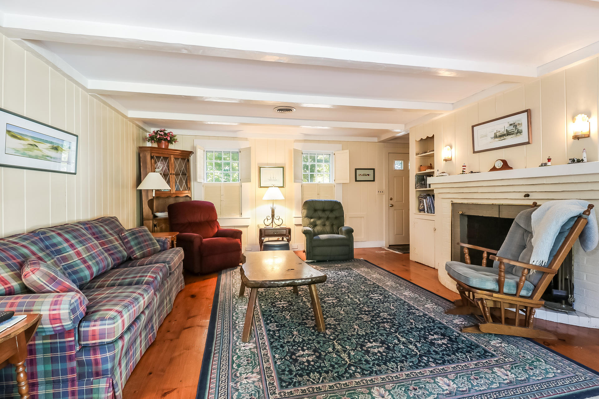 45 Brooks Road Harwich Port, MA 02646 - Photo 10 of 34 a living room with furniture and a fireplace