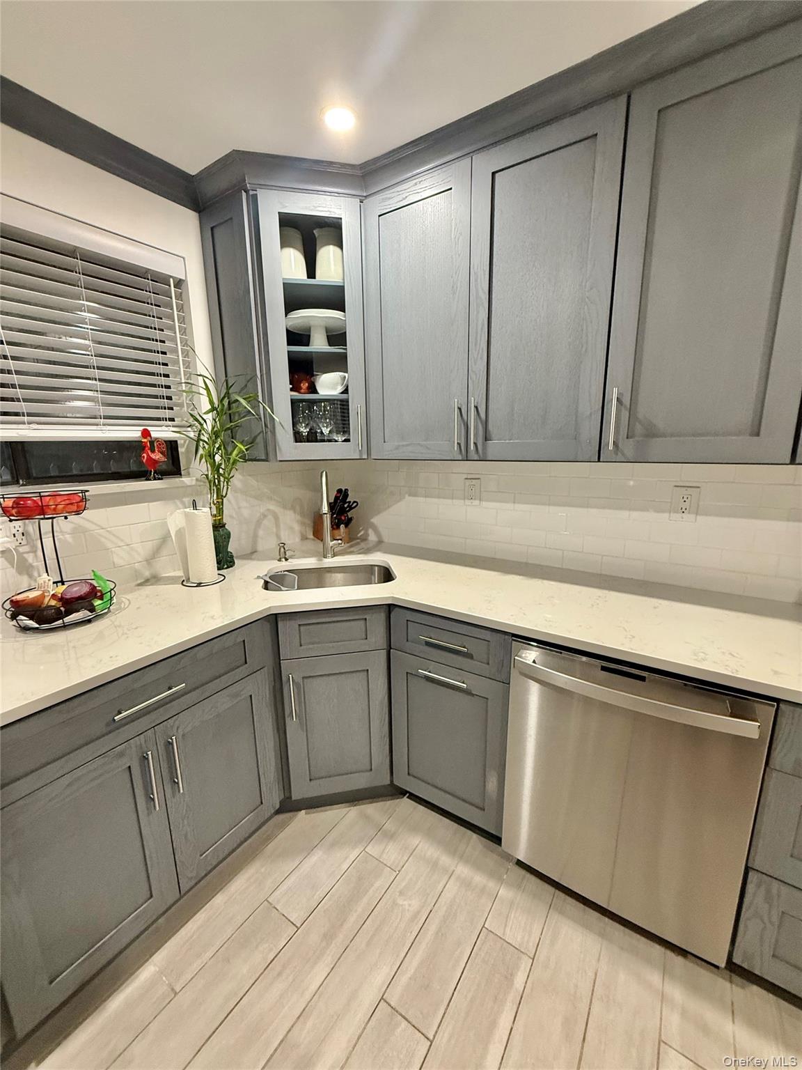 42 Briar Cliff, Unit 4 2 Ossining, NY 10562 - Photo 16 of 22 a kitchen with a sink cabinets and window