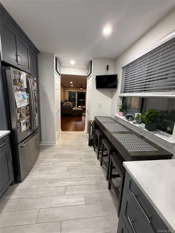 a kitchen with stainless steel appliances granite countertop a sink and a stove
