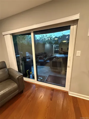 a view of sitting area with furniture and floor to ceiling window