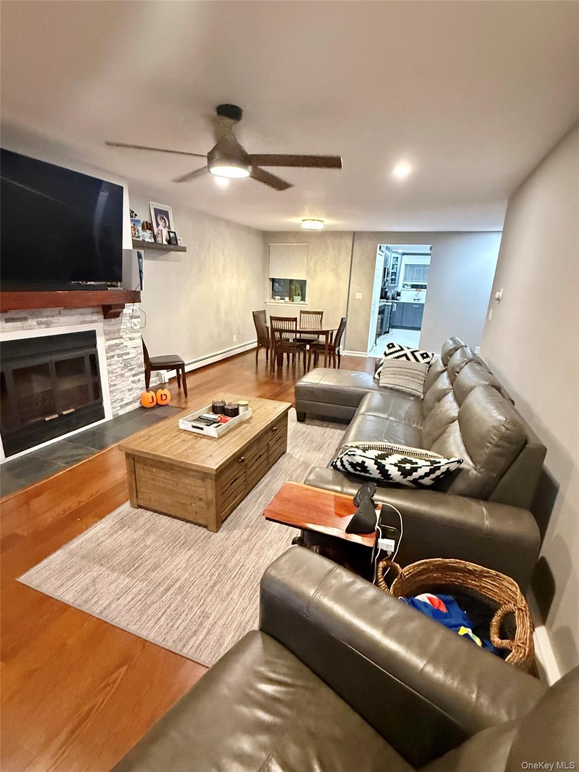 42 Briar Cliff, Unit 4 2 Ossining, NY 10562 - Photo 2 of 22 a living room with furniture and a flat screen tv
