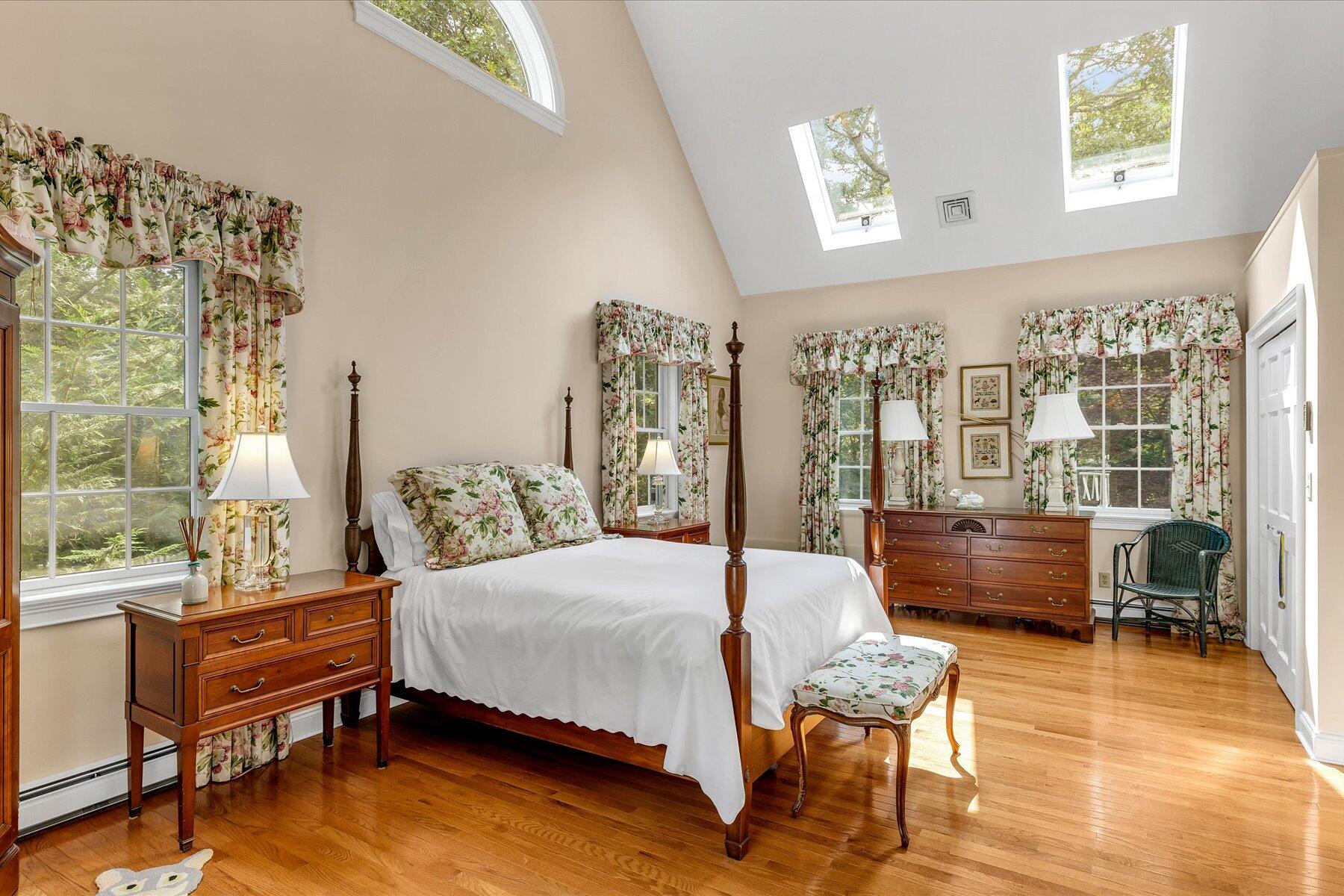 663 Crowells Bog Road Brewster, MA 02631 - Photo 16 of 46 a bedroom with a bed and a large window with the outer view