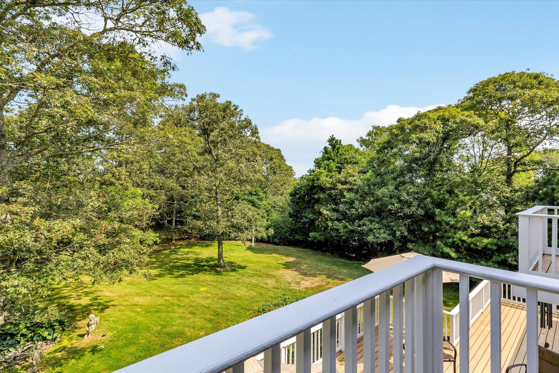663 Crowells Bog Road Brewster, MA 02631 - Photo 23 of 46 a view of a swimming pool with a balcony