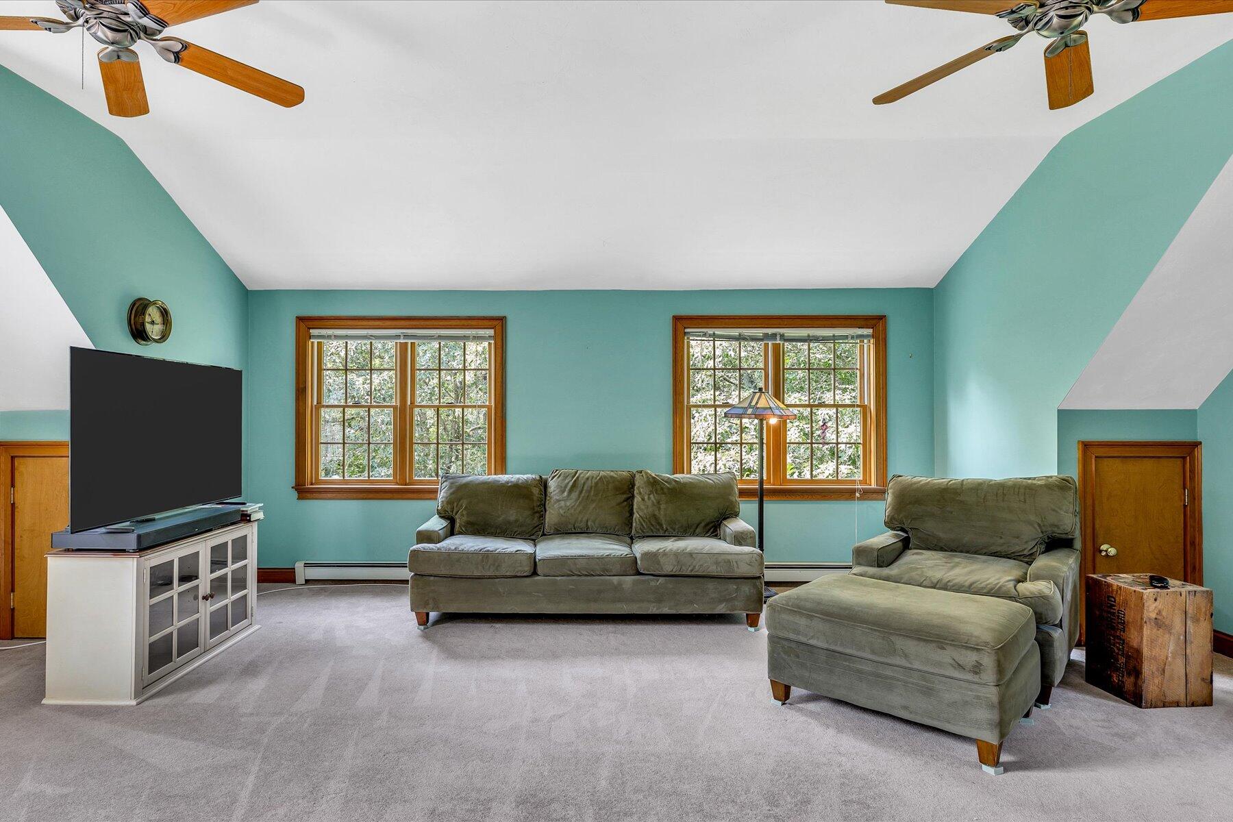 663 Crowells Bog Road Brewster, MA 02631 - Photo 28 of 46 a living room with furniture and a flat screen tv